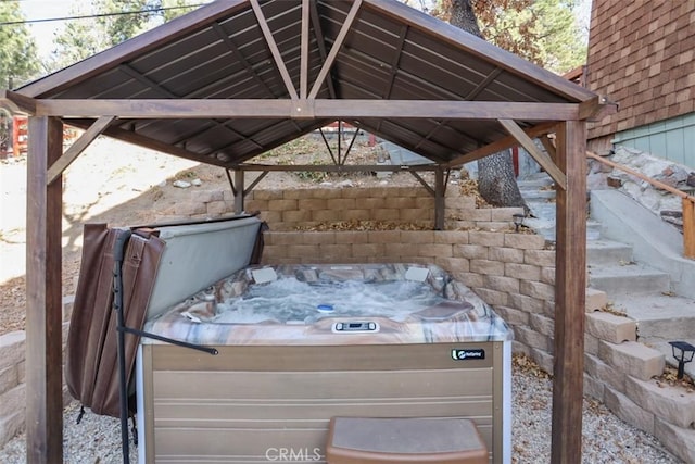 exterior space with a hot tub