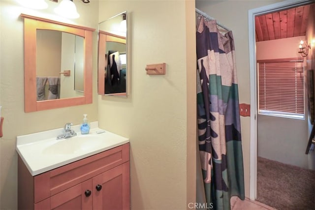 full bathroom featuring vanity and a shower with curtain