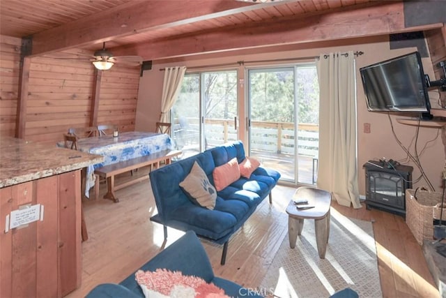 living room with ceiling fan, wood ceiling, light hardwood / wood-style floors, and beam ceiling