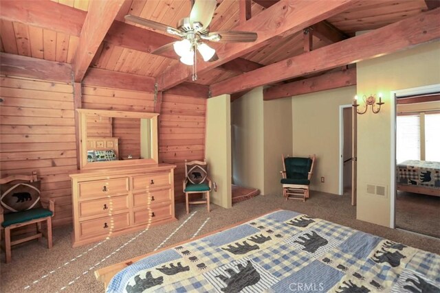 bedroom featuring ceiling fan, vaulted ceiling with beams, wooden walls, carpet flooring, and wooden ceiling