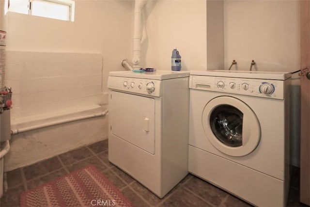 clothes washing area with washing machine and clothes dryer