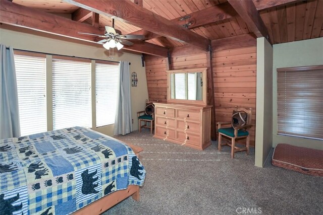 carpeted bedroom featuring ceiling fan, vaulted ceiling with beams, wood walls, and wooden ceiling