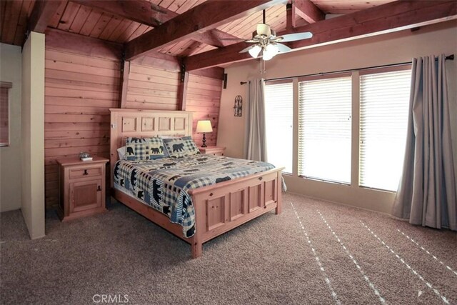 bedroom featuring wood ceiling, light carpet, and wooden walls