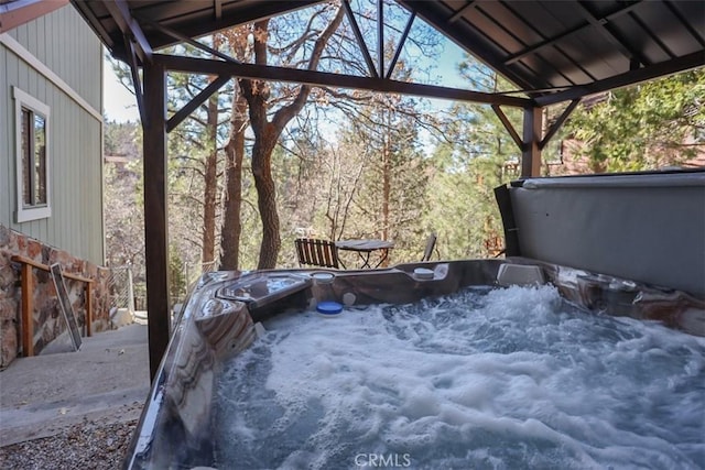 exterior space featuring a hot tub