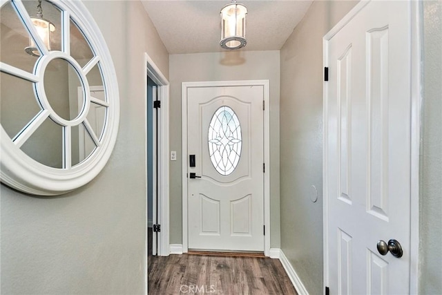 doorway to outside with dark hardwood / wood-style flooring