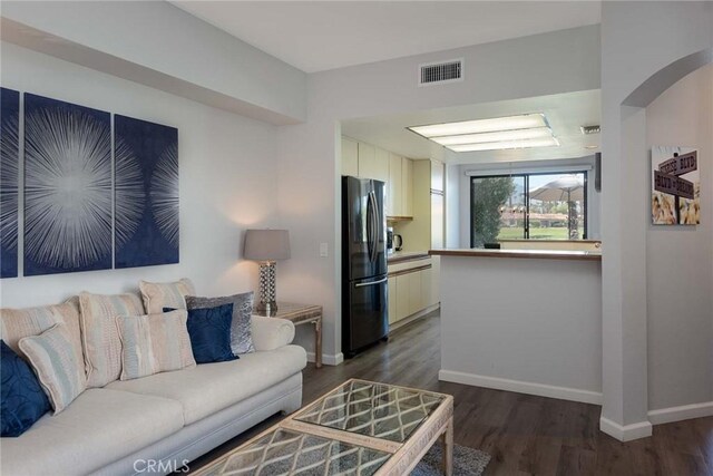 living room with dark wood-type flooring