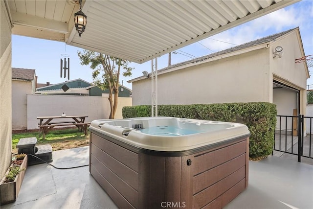 view of patio featuring a hot tub