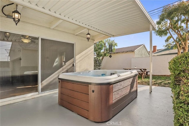 view of patio / terrace with a hot tub