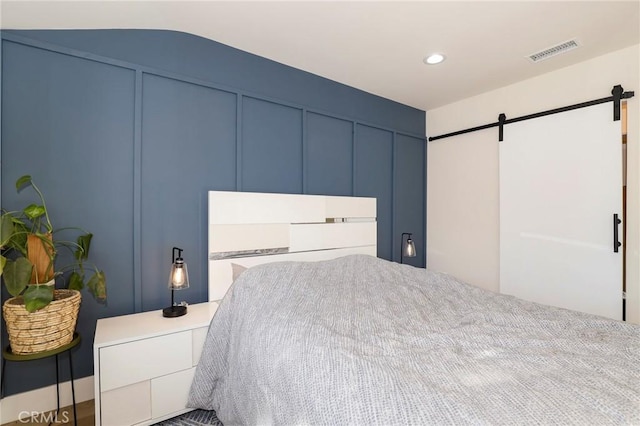 bedroom with a barn door