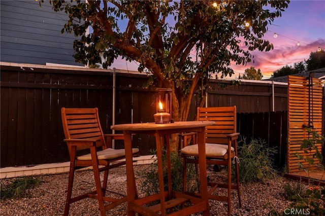 view of patio terrace at dusk