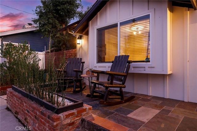 view of patio terrace at dusk