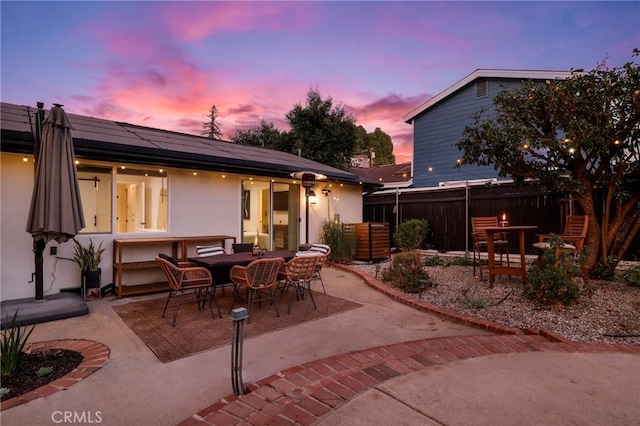 view of patio terrace at dusk