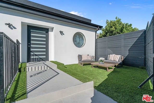 doorway to property featuring a yard