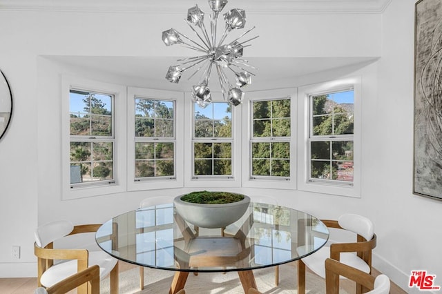 sunroom / solarium featuring a notable chandelier and a healthy amount of sunlight