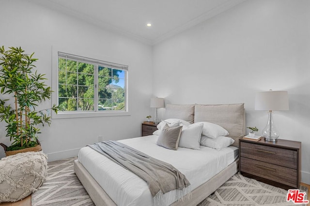 bedroom with ornamental molding