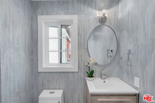 bathroom with vanity and toilet