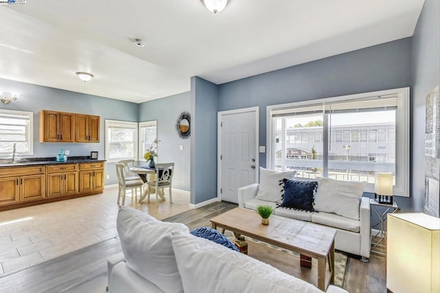 living room with plenty of natural light and sink