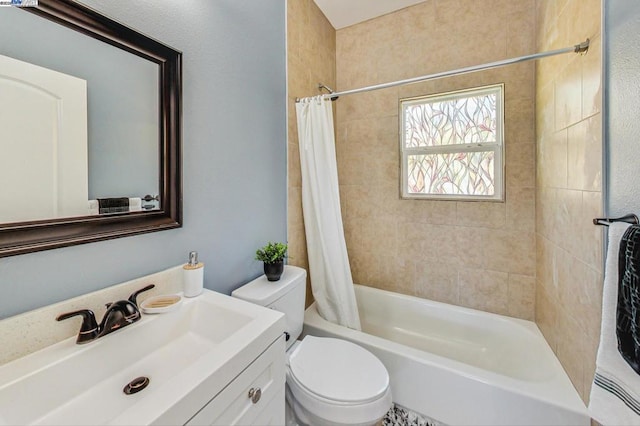 full bathroom with toilet, vanity, and shower / bath combo with shower curtain