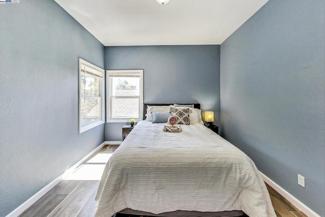 bedroom with light wood-type flooring