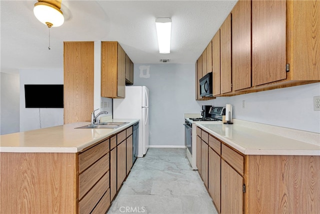 kitchen with sink, a textured ceiling, black appliances, and kitchen peninsula