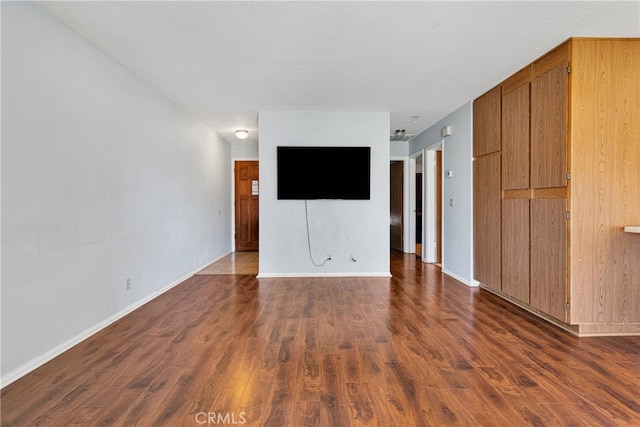 empty room featuring dark hardwood / wood-style flooring