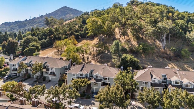 birds eye view of property with a mountain view