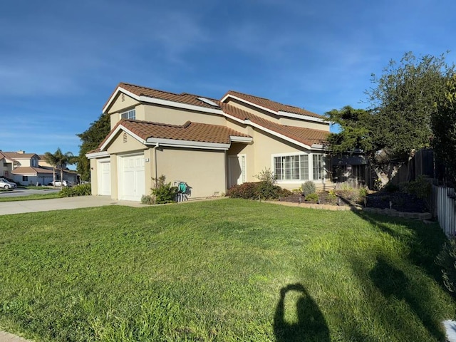 view of front facade featuring a front lawn and a garage