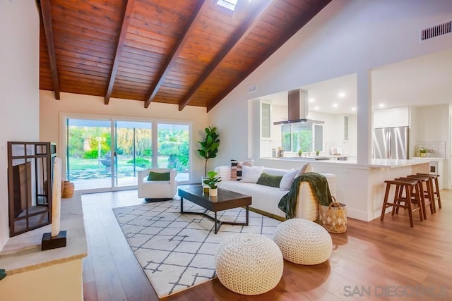 living room featuring beam ceiling, high vaulted ceiling, wood ceiling, and light hardwood / wood-style floors