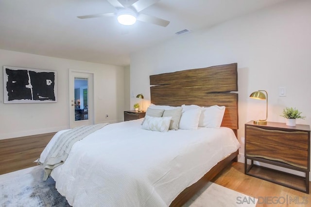 bedroom with ceiling fan and wood-type flooring