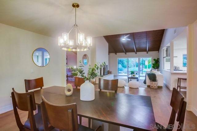 dining area with wooden ceiling, wood-type flooring, a notable chandelier, and vaulted ceiling