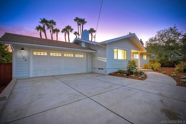 ranch-style house featuring a garage