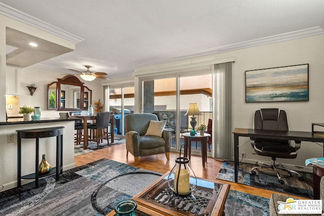 living room with ceiling fan, ornamental molding, and light hardwood / wood-style flooring