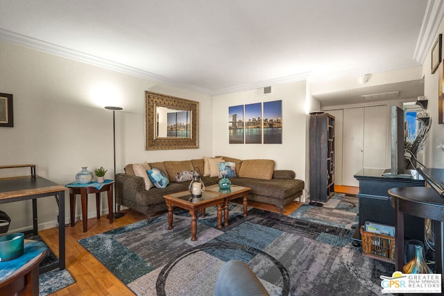 living room featuring wood-type flooring and ornamental molding