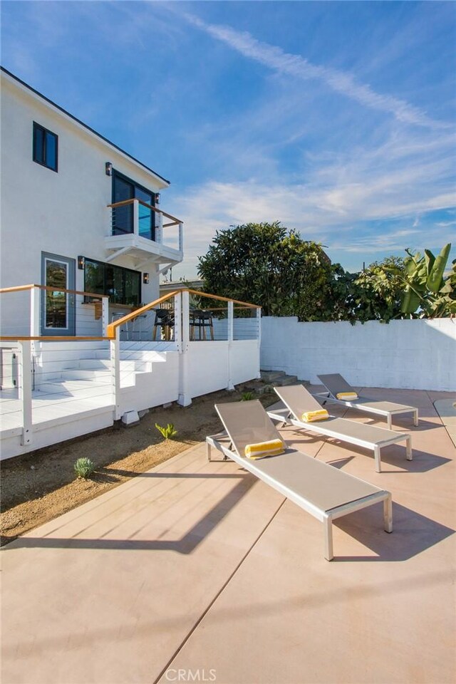 view of patio with a balcony