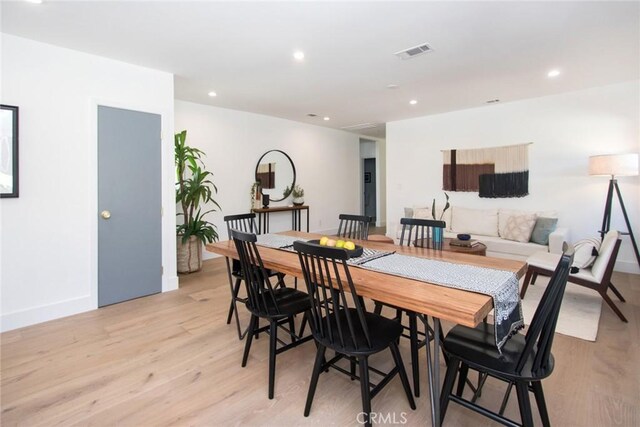 dining space featuring light hardwood / wood-style flooring