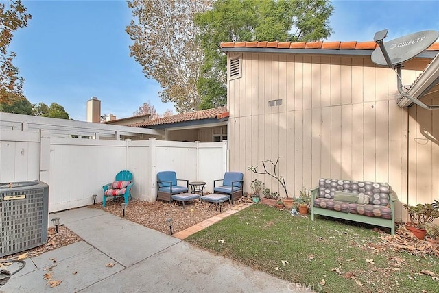 exterior space featuring central AC unit and a patio