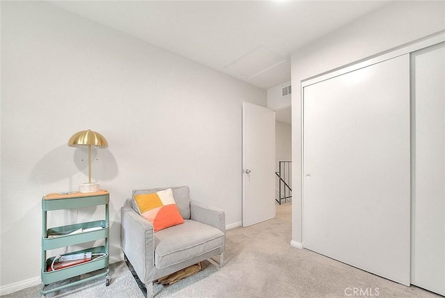 sitting room with light carpet