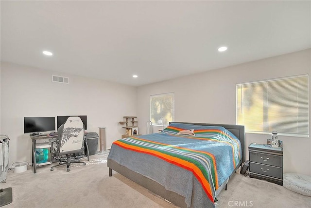 bedroom featuring light colored carpet