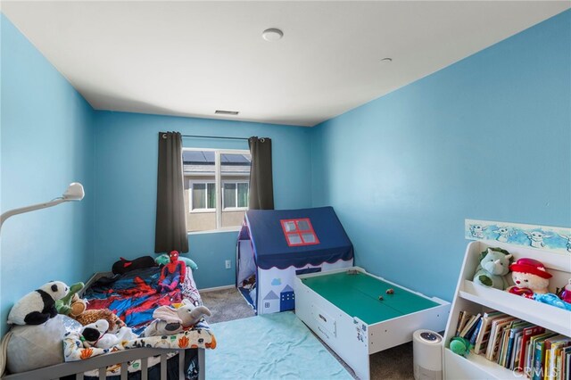 bedroom with light colored carpet