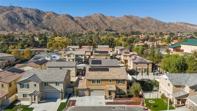 birds eye view of property featuring a mountain view and a residential view