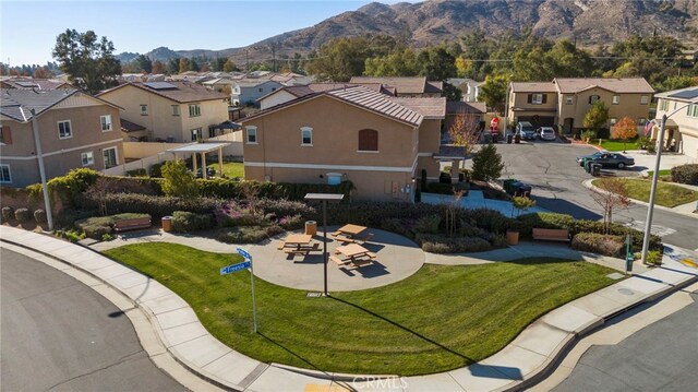 birds eye view of property featuring a mountain view