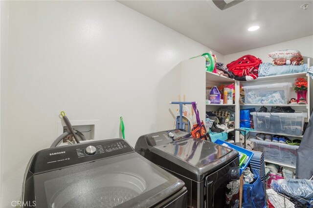 clothes washing area featuring washing machine and dryer