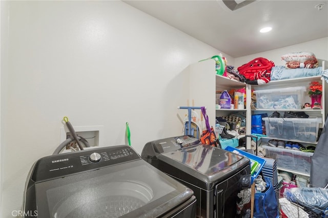 clothes washing area with laundry area and washing machine and clothes dryer