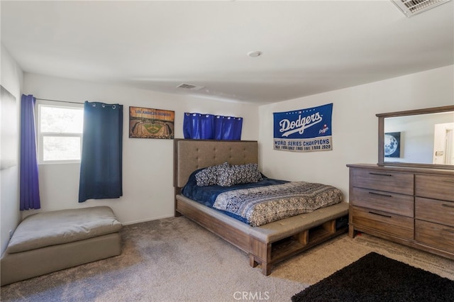 bedroom with light colored carpet and visible vents