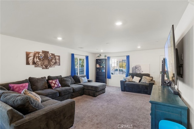 carpeted living area featuring recessed lighting