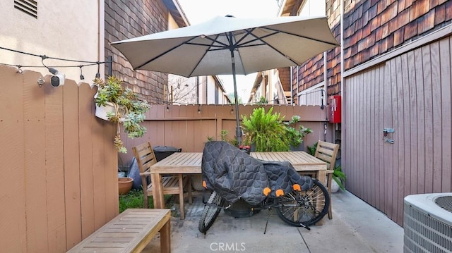 view of patio with central AC unit