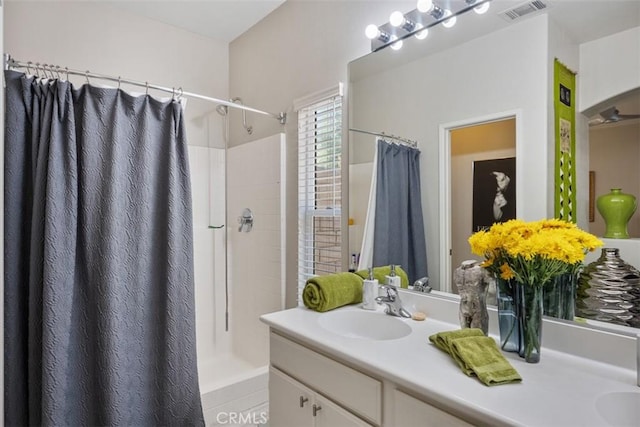 bathroom with vanity and walk in shower