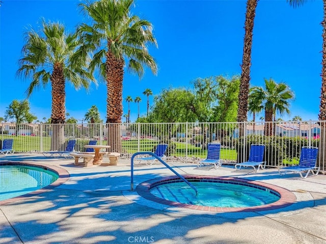 view of pool featuring a patio area and a community hot tub