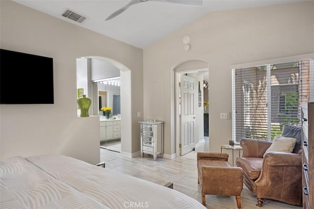 bedroom with vaulted ceiling, ceiling fan, and ensuite bathroom