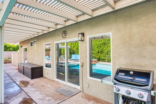 view of patio featuring a pergola and a grill